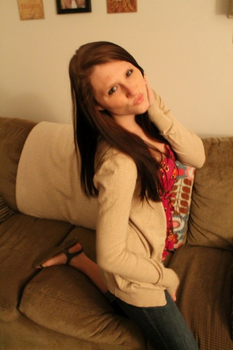 Solo girl Freckles 18 covers up her naked tits and pussy on a sofa 70545341