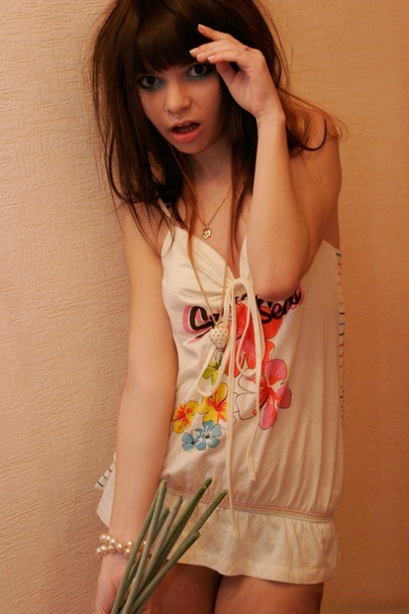 Charming teen Kaira 18 holds a bunch of flowers during a non nude shoot 85783672