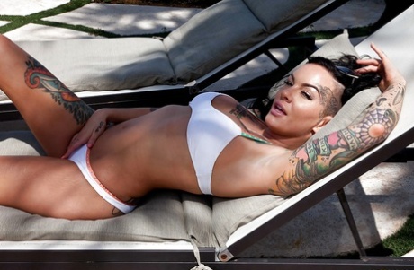 Tattooed whore Lolo Luscious exposing big hooters in swimming pool 92057054